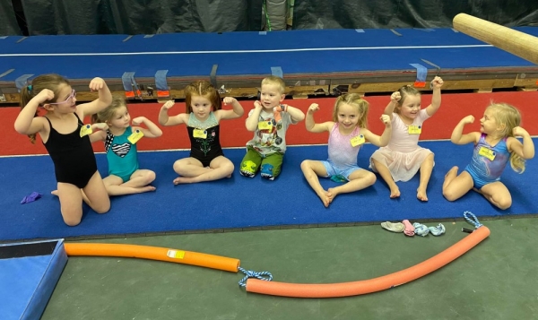 Maverick Gymnastics Slider for Tots showing off their muscles